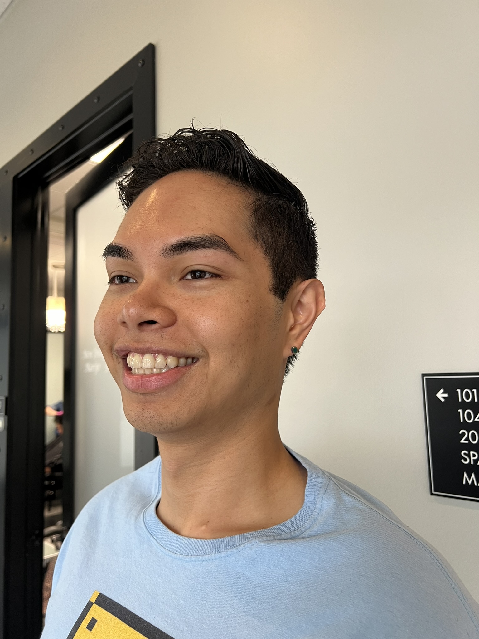 Image of a teen showing of clean haircut from Beards and Beauty's in Cedar Park, Texas
